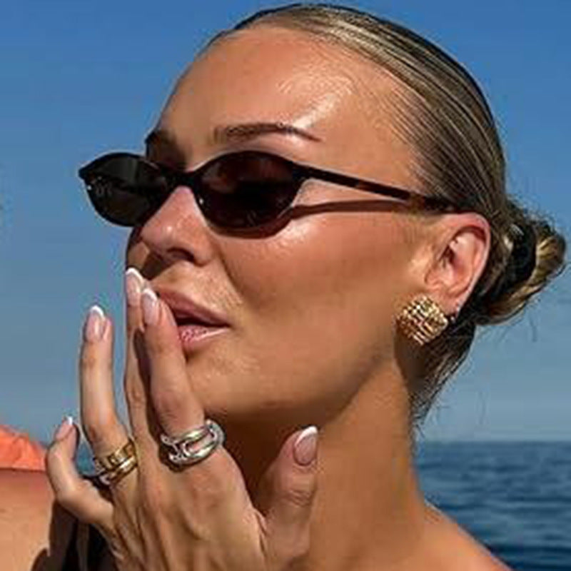 Damer ovalformede solbriller med transparent ramme og UV-beskyttelse Skanto