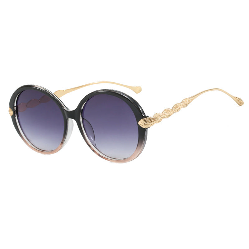 Dame stor rund solbrille med dekorative metalakser Skanto