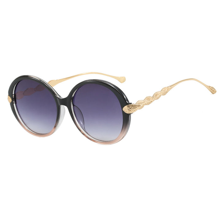 Dame stor rund solbrille med dekorative metalakser Skanto