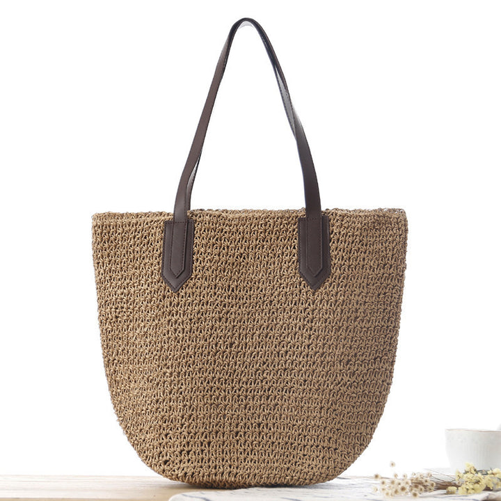 Woven natural material handbag with sturdy leather handles Skanto