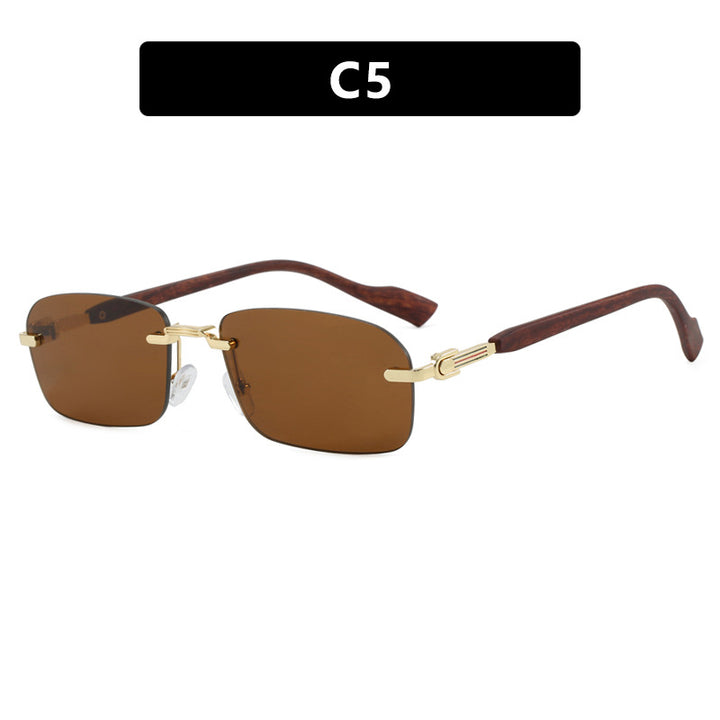 Dame solbrille med elegant metallramme og stilige tre detaljer Skanto