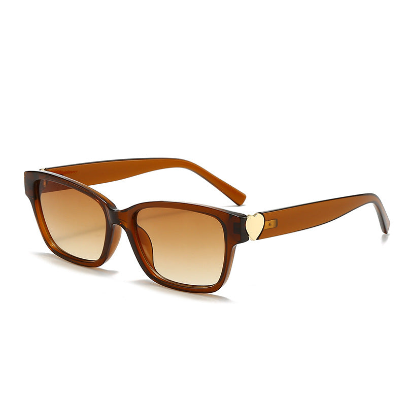 Dame moterik kvadratisk solbrille med hjerte-senter Skanto