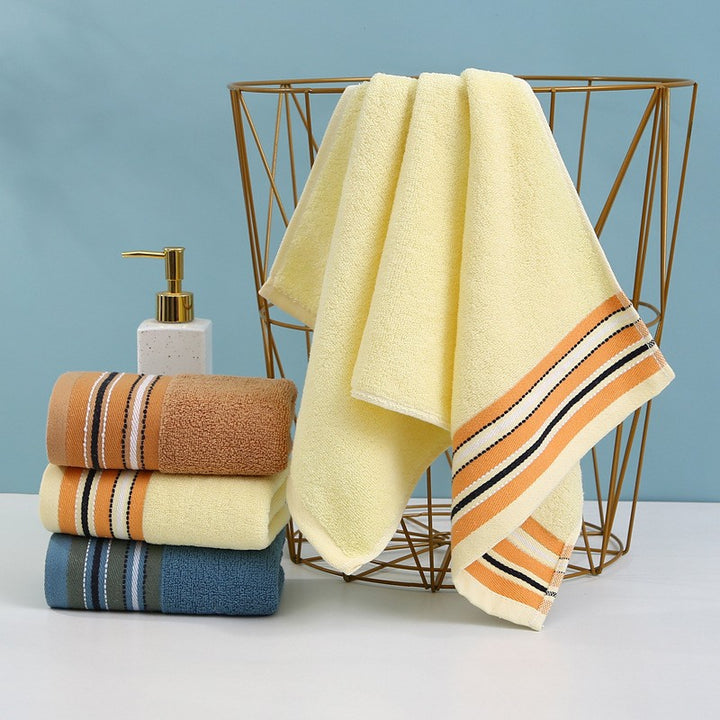 Premium terry towel with elegant stripe border.