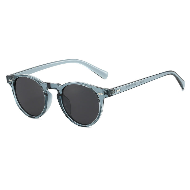 Dame vintage solbriller med runde glass og transparent ramme Skanto