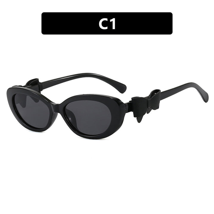 Dame moteriktig solbrille med lekent sløyfedesign Skanto