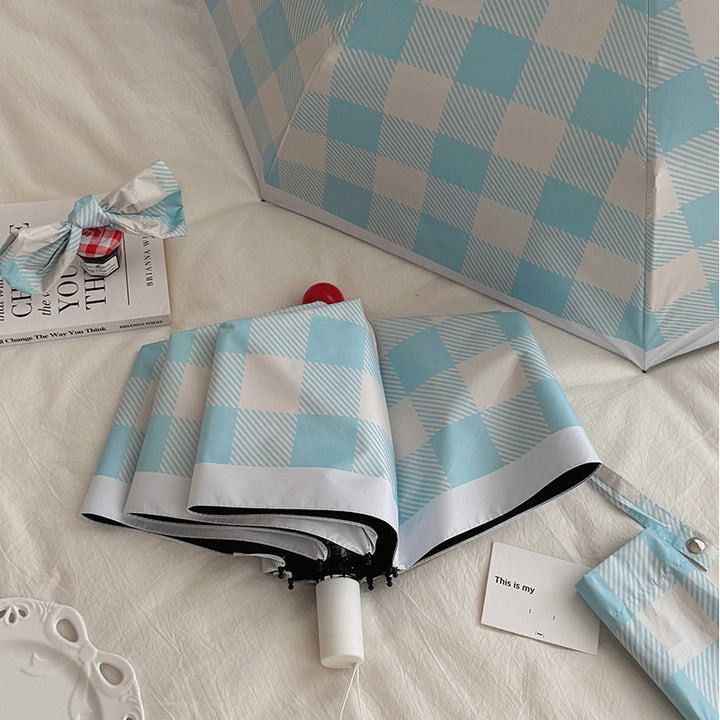 Dame sammenleggbart paraply med spesiell design Skanto