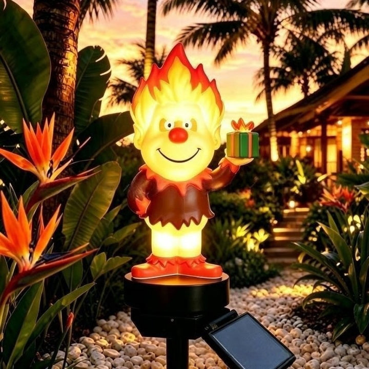 Solar-powered cartoon flame figure garden stake light with acrylic diffuser and adjustable ground spike Skanto
