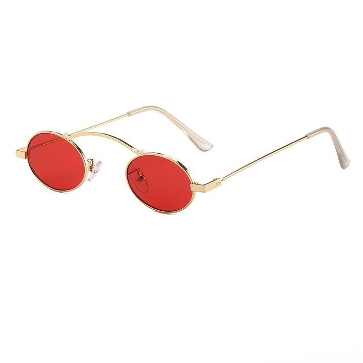 Dame moteriktig solbrille med unike sirkulære rammer og karakteristiske linser Skanto