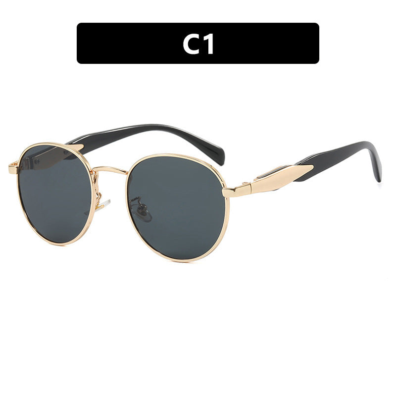 Dame rund solbrille med elegant, gullramme og UV-beskyttelse Skanto