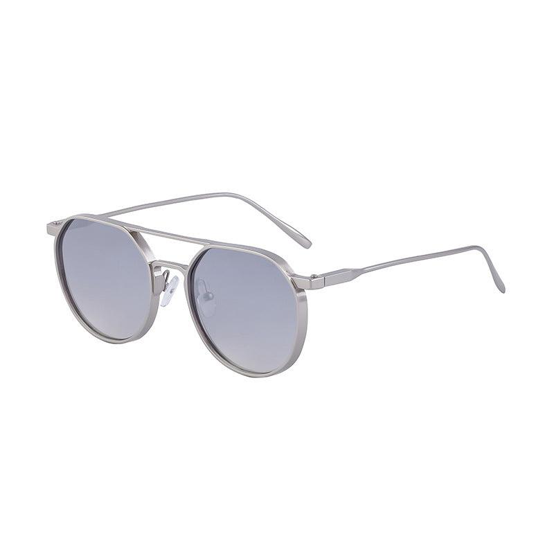 Dame moterik solbrille i stilfullt rundt design Skanto