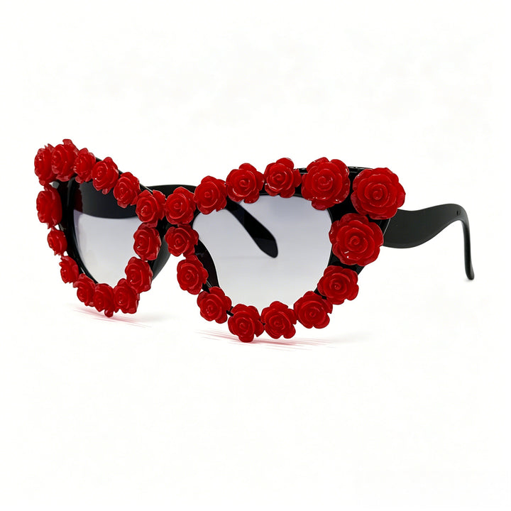 Damen hjerteformet solbrille med blomsterapplikasjon Skanto