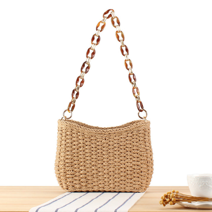 Modern straw bag with chain handle Skanto