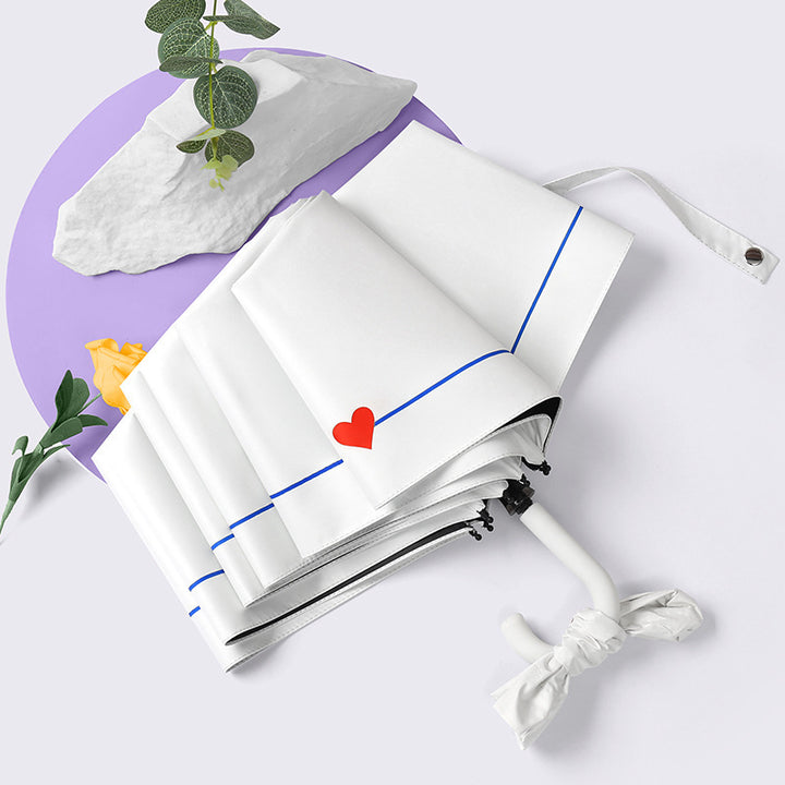 Dame sammenleggbart paraply med elegant hjerte-design Skanto