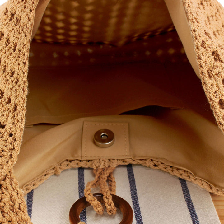 Handbag made of hand-knotted natural material with stylish fringe details Skanto