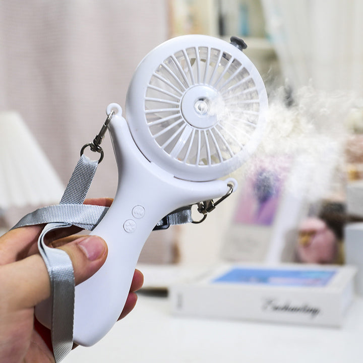 Dame bærbar håndvifte med ergonomisk design og sprayfunksjon Skanto