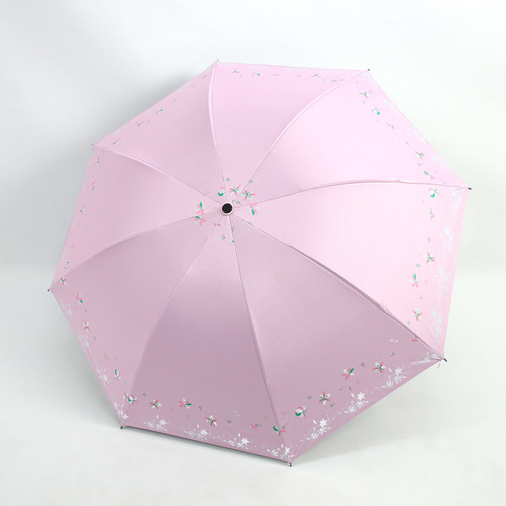 Kvinnens sammenleggbare paraply med blomstermønstre Skanto