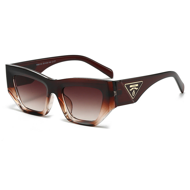 Dame Designer solbrille med moderne, geometrisk ramme Skanto