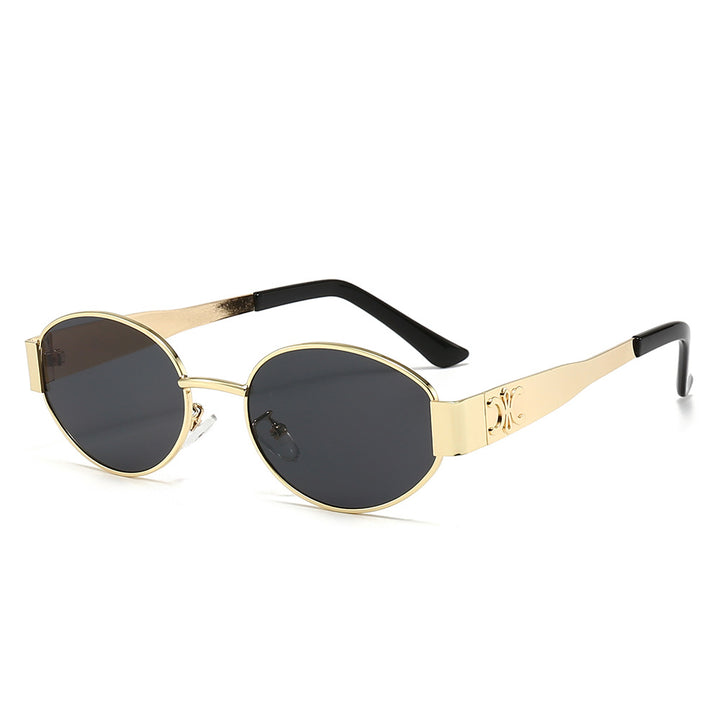 Dame Designer-solbrille med elegant oval ramme og unike aksenter Skanto