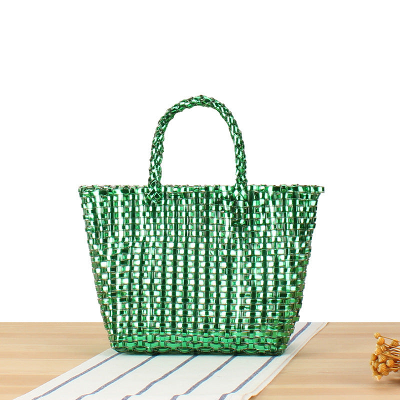 Handbag made of woven natural material with elegant accents Skanto