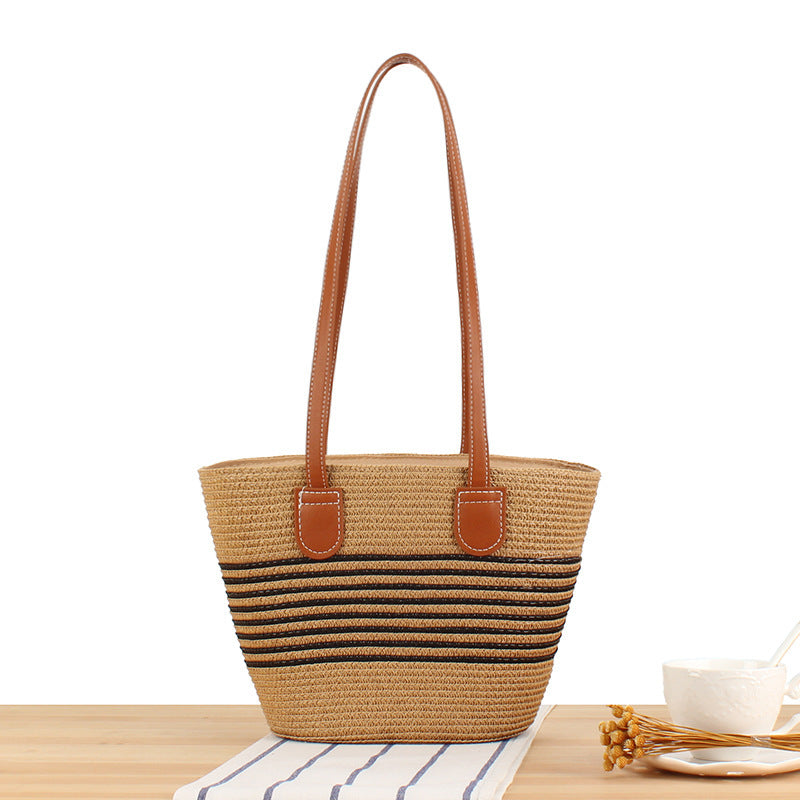 Handbag made of high-quality raffia with elegant leather handles Skanto