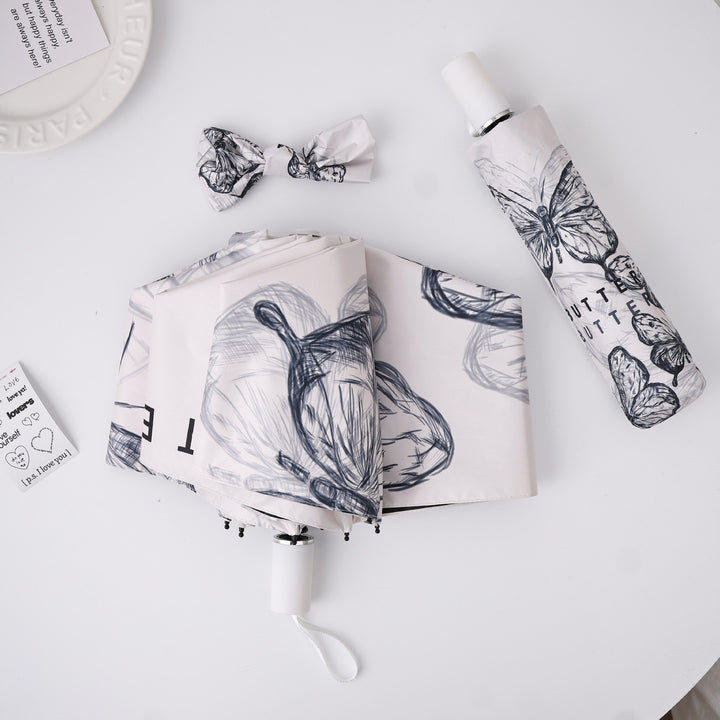 Dame fashionable foldeparaply med leken design Skanto