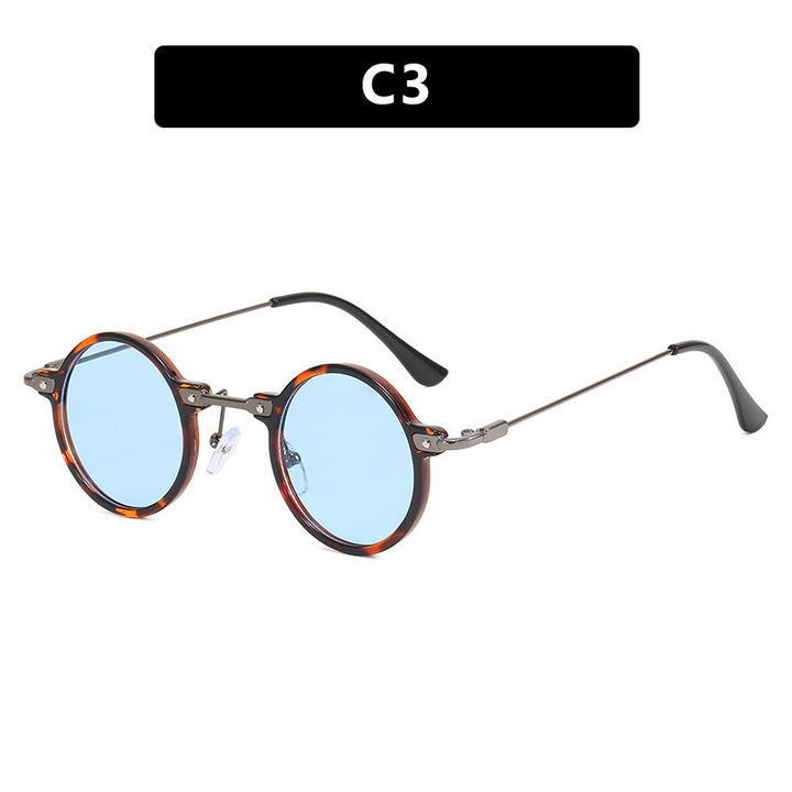 Dame rund solbrille med moderne metallramme og store blå linser Skanto