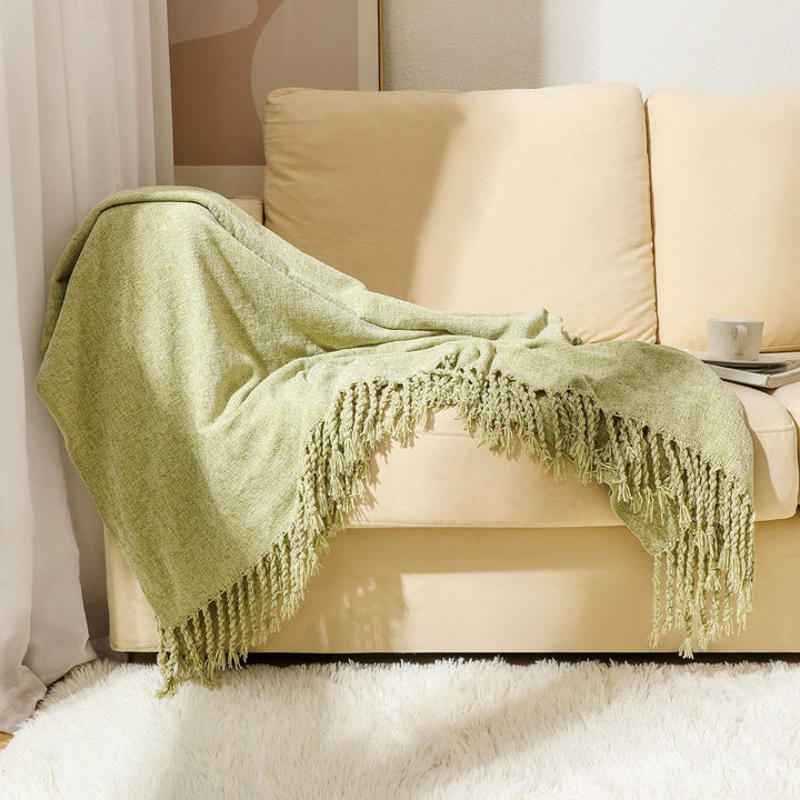 Kvinnelig elegant og stilfull sofa teppe med frynser Skanto