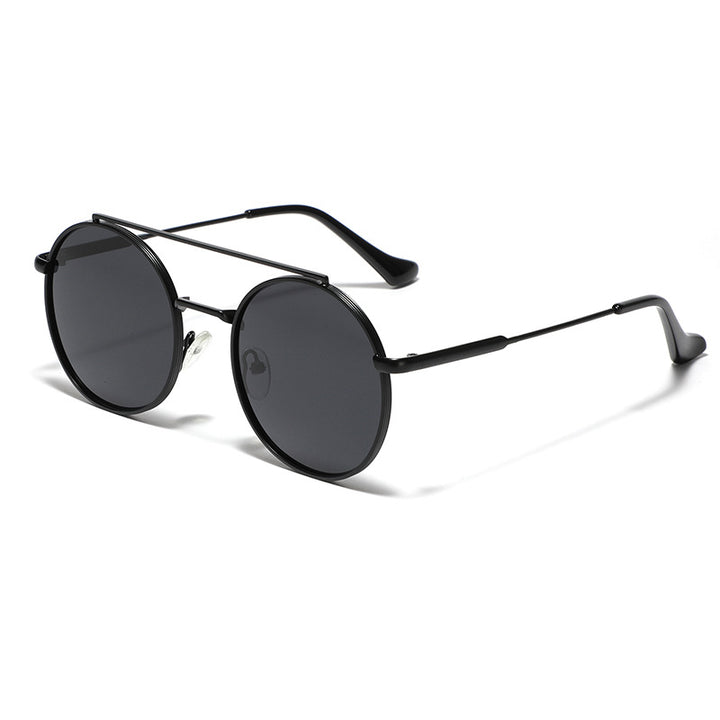 Dame rund solbrille med moteramme Skanto