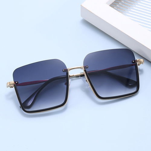 Dame oversized solbrille med elegant geometrisk ramme Skanto