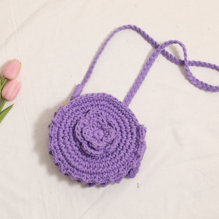 Håndheklede crossover-veske med florale detaljer Skanto