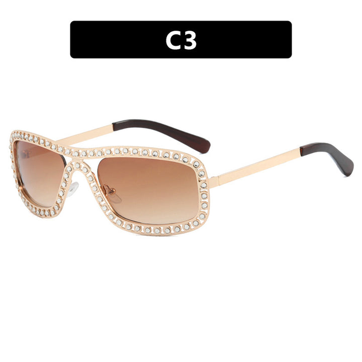 Dame moteriktig solbrille med glitrende ramme Skanto