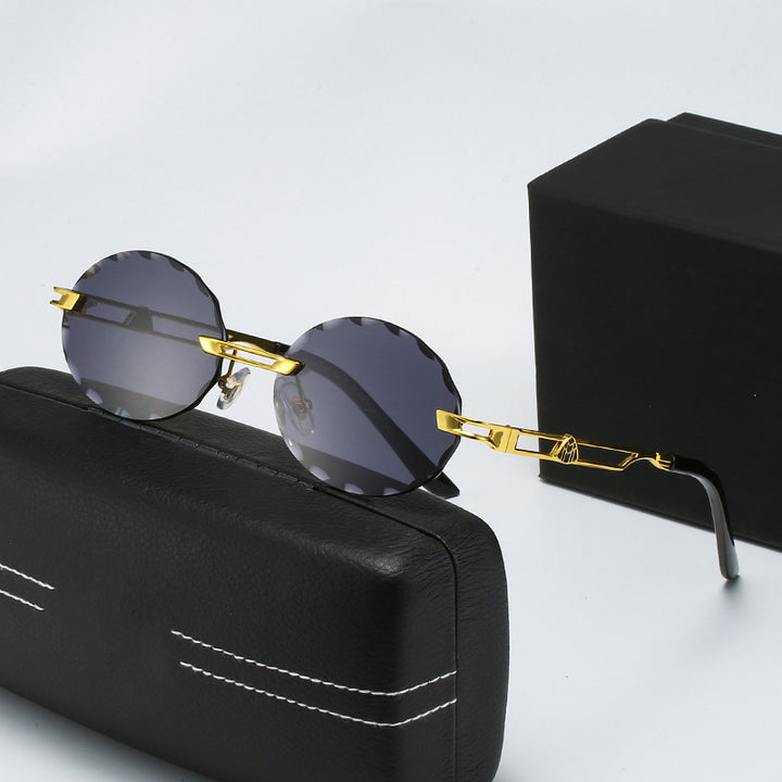 Dame rund solbrille med unikt bølgedesign og høykvalitets metallramme Skanto
