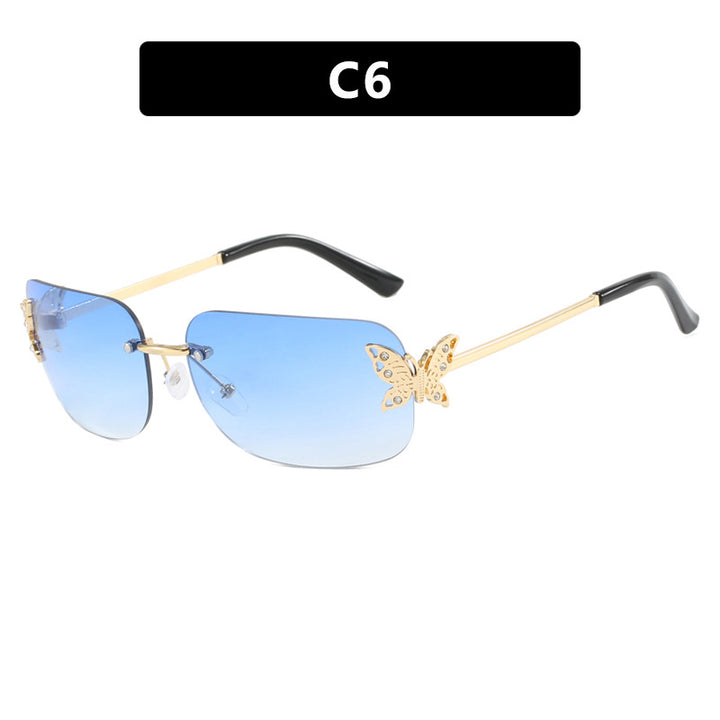 Dame moteriktig solbrille med filigran sommerfugldesign og beskyttende glass Skanto