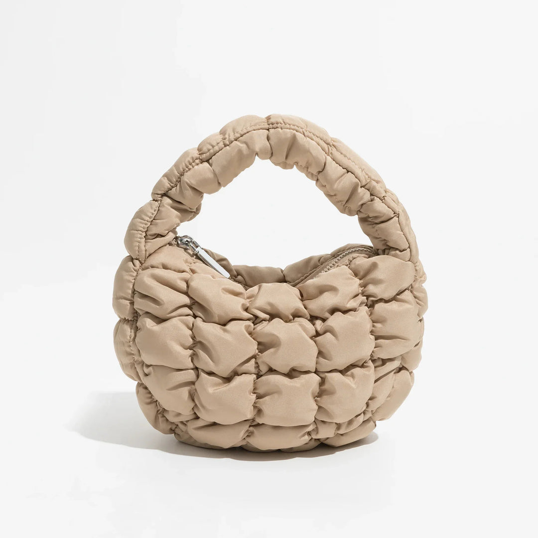 Skanto | Livlig quiltet rund mini bag