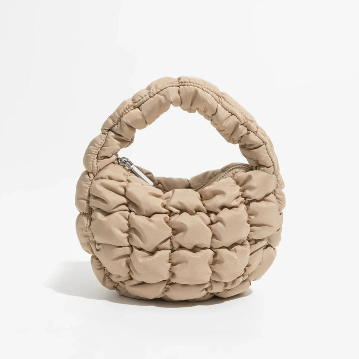 Skanto | Livlig quiltet rund mini bag