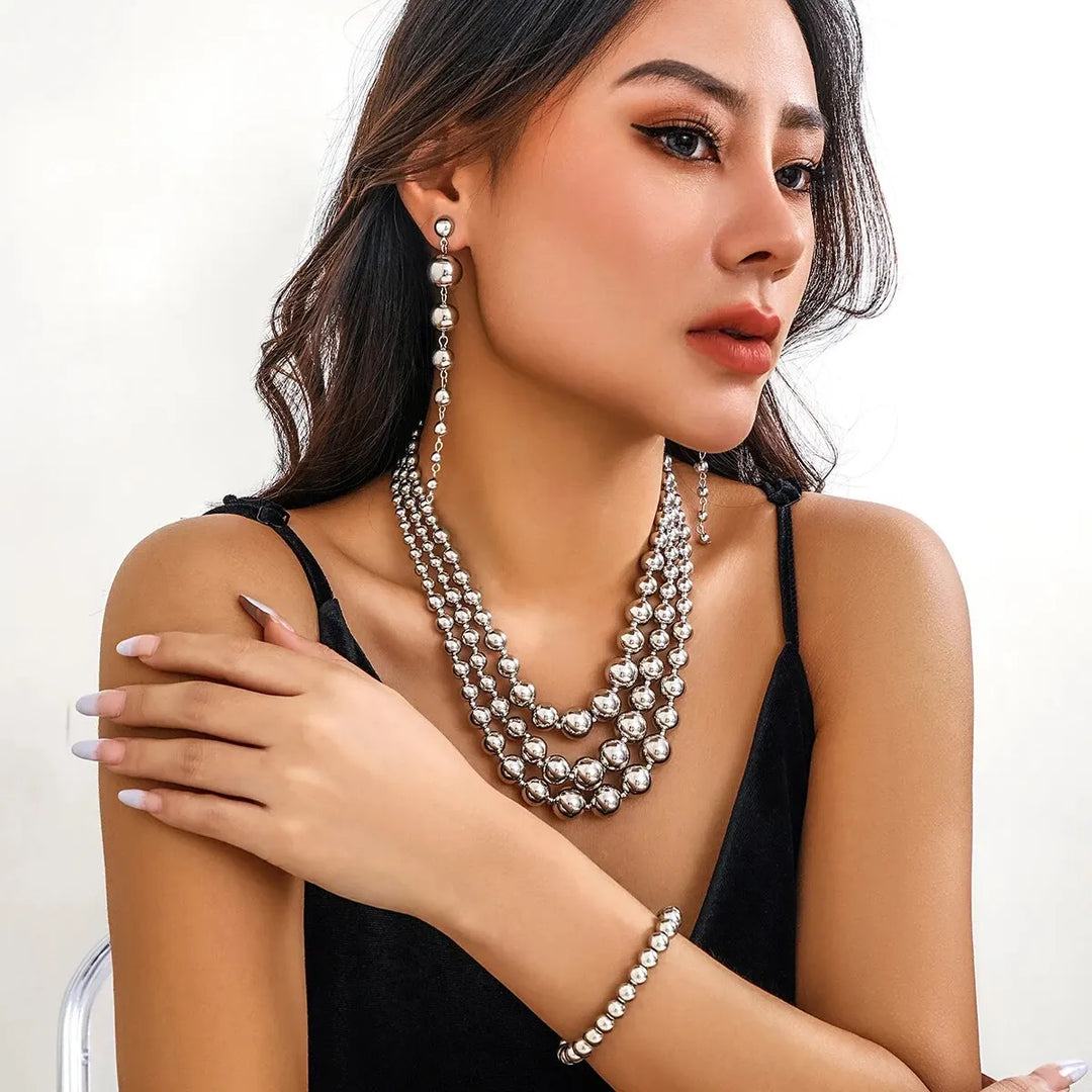 Skanto | Bold Triple Stack Dangle Øredobber, Halskjede, Armbånd Sett