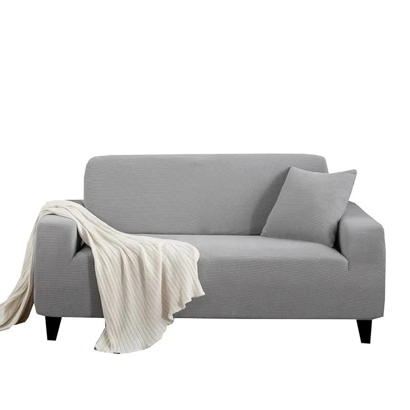 Skanto | CushionWrap - Elastisk, halkefri sofatrekk