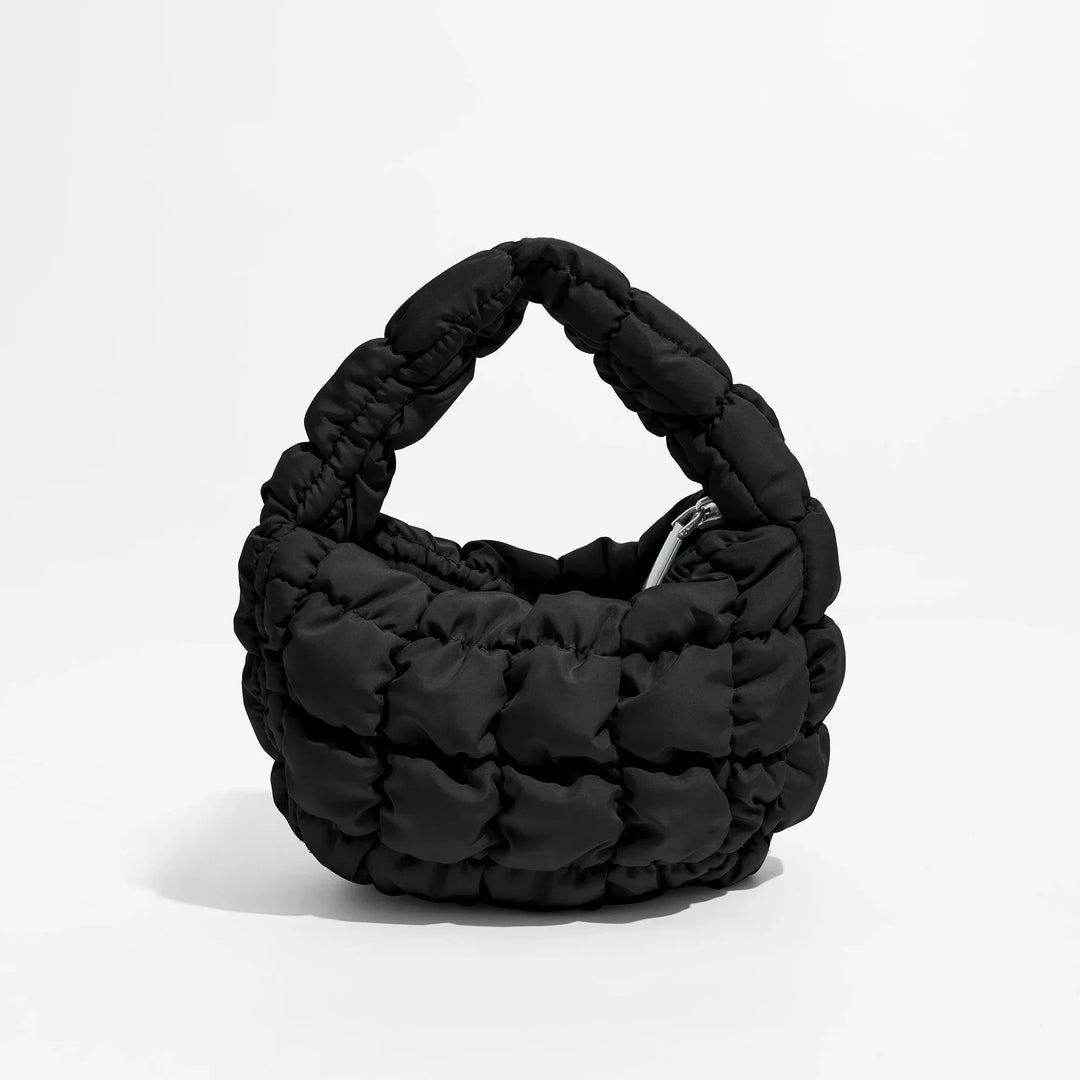 Skanto | Livlig quiltet rund mini bag