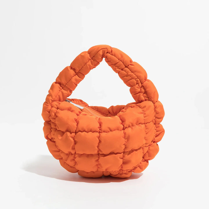 Skanto | Livlig quiltet rund mini bag