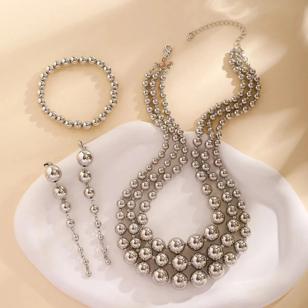 Skanto | Bold Triple Stack Dangle Øredobber, Halskjede, Armbånd Sett