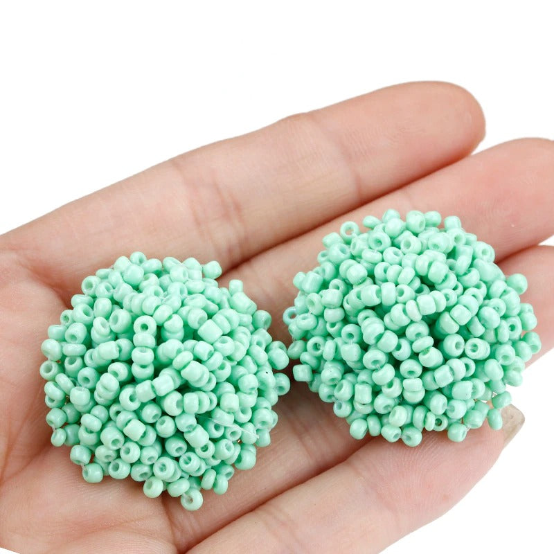 Skanto | Lys og morsom håndlaget multicolor perle pompom stud øredobber