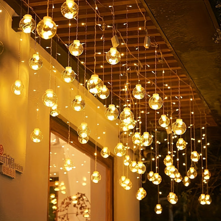Skanto | Eventyrlys med hengende globusornamenter