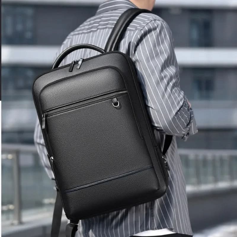 Skanto | Elegant lær ryggsekk for menn/kvinner med USB-port for laptop og hverdagsbruk, 15,6 tommer, svart