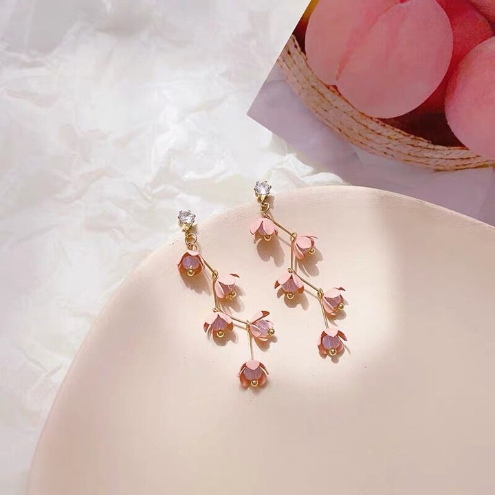 Skanto | Lange rhinestone krystall rosa sakura blomst med zircon klips øredobber