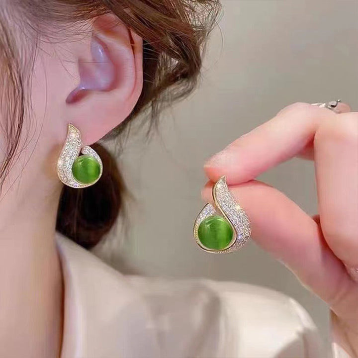 Skanto | Elegante øredobber med perleimitasjon og rhinestone
